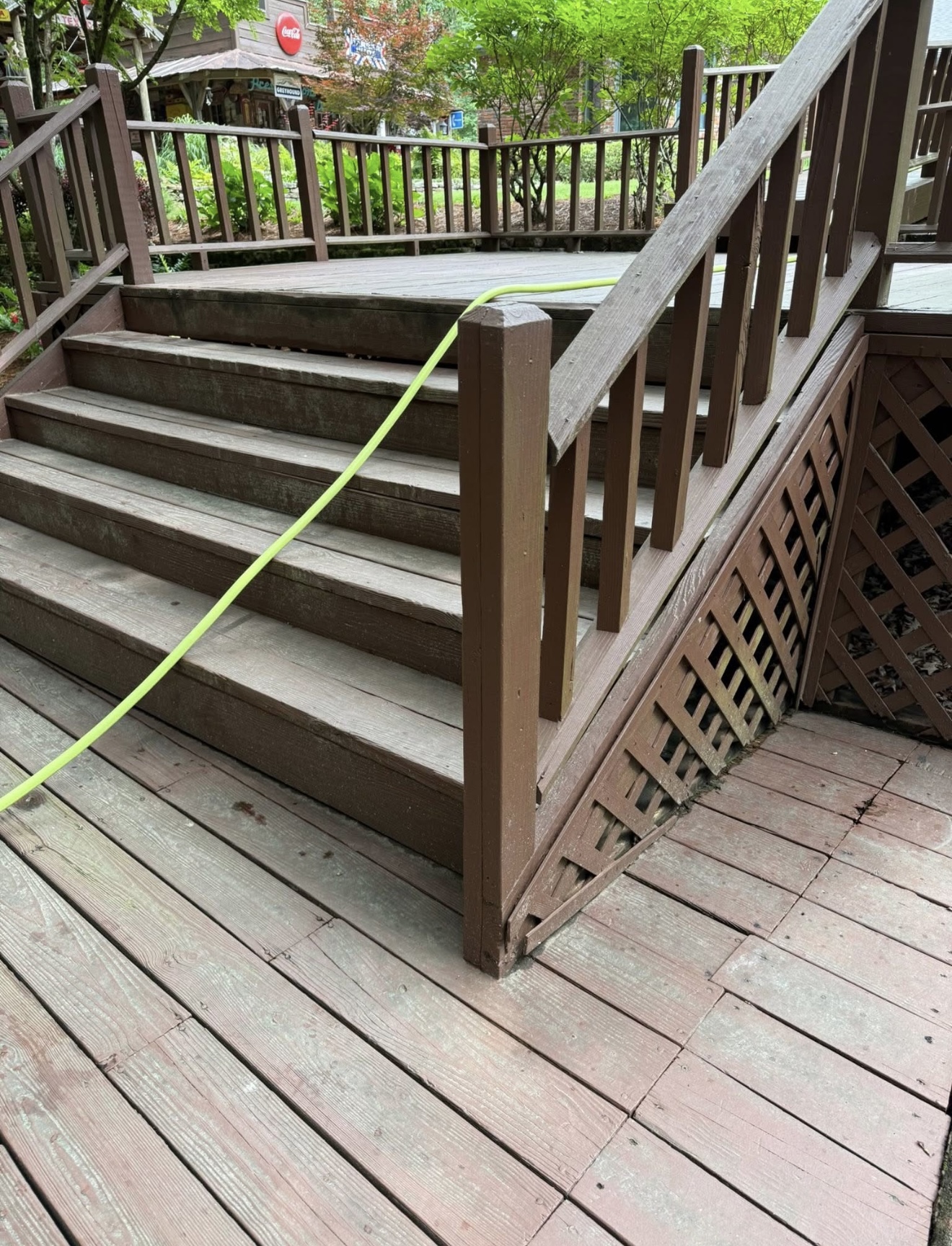 Gray weathered wood deck before pressure washing in Columbus, GA