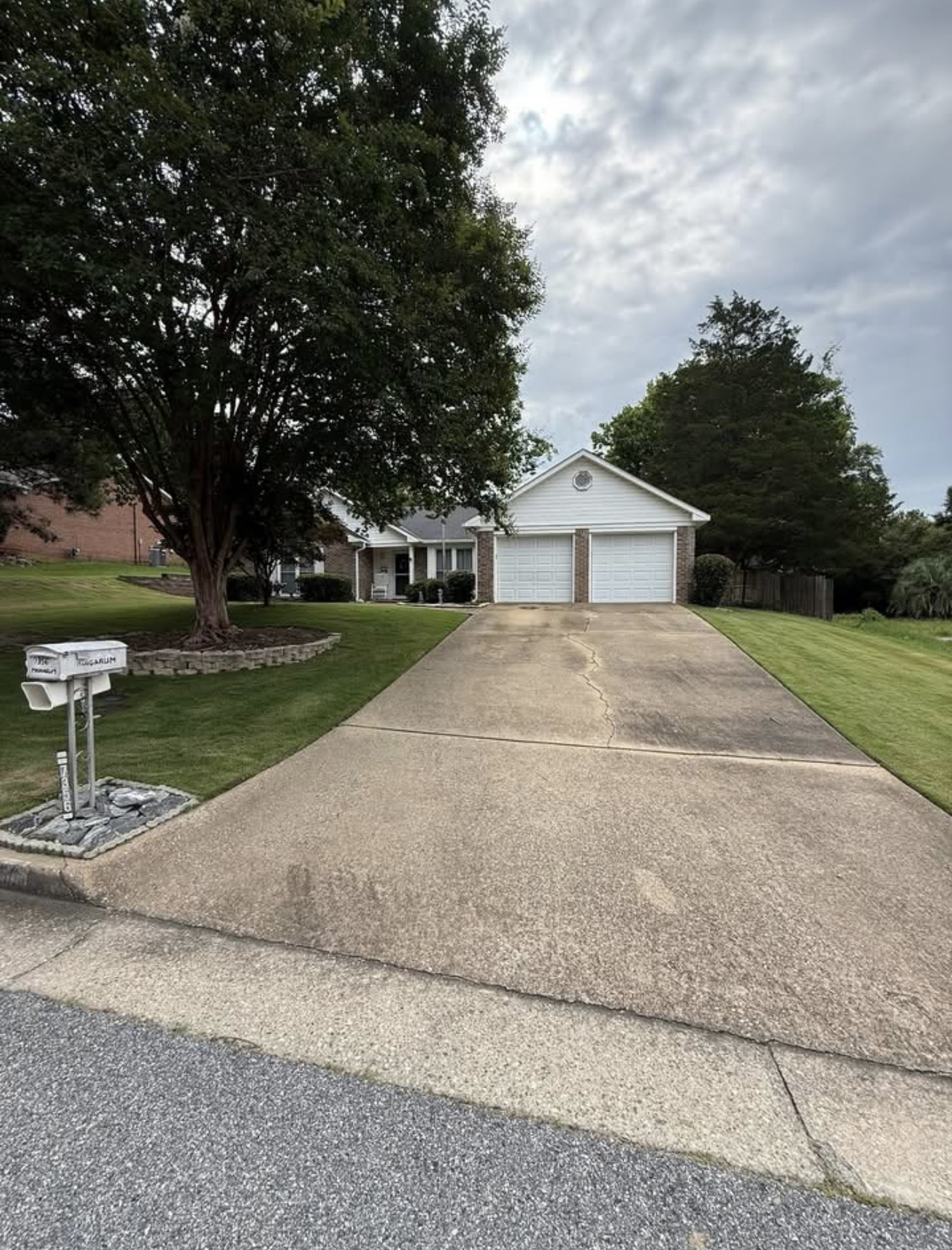 Dirty stained driveway before pressure washing in Columbus, GA