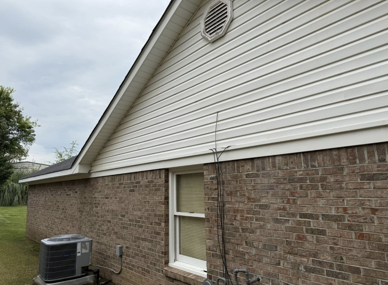 Clean vinyl siding and brick after a soft wash house washing in Columbus, GA