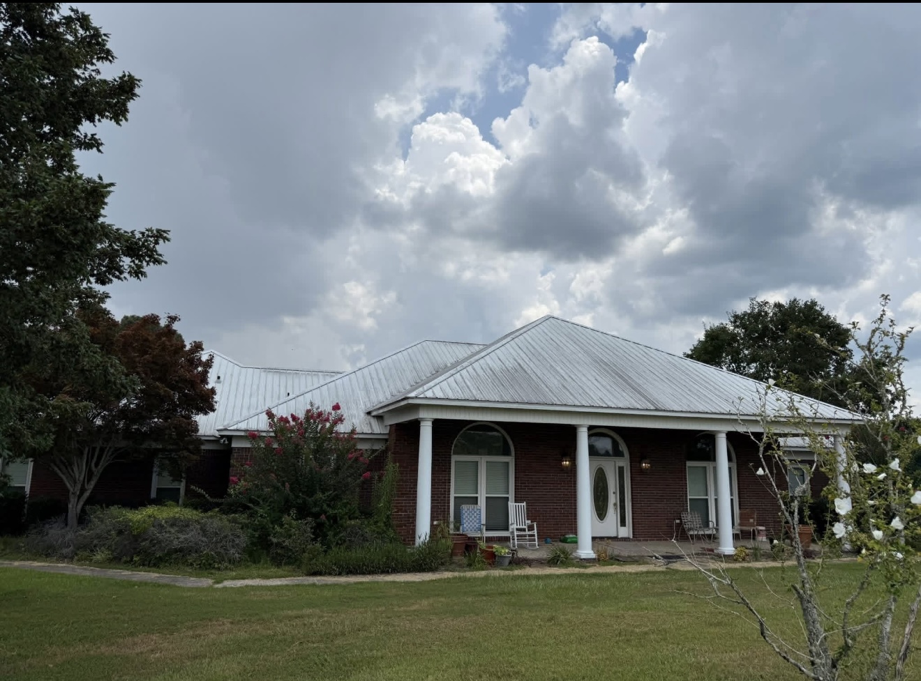 Dull, streaked metal roof before soft wash roof cleaning in Columbus, GA