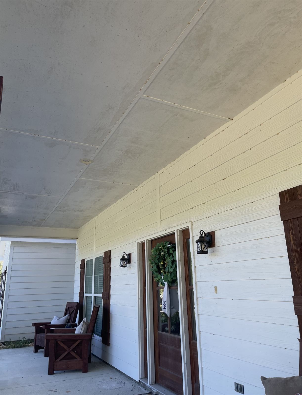 Dingy gray porch ceiling before a soft wash in Columbus, GA