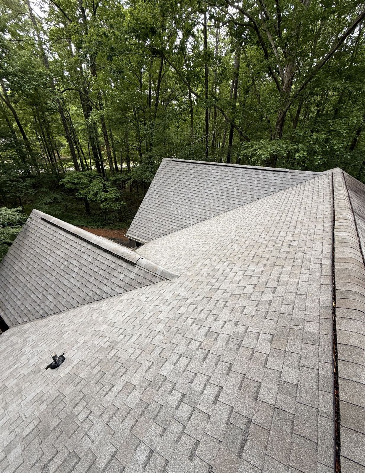 Clean shingle roof ridges and valleys after soft wash roof cleaning in Columbus, GA