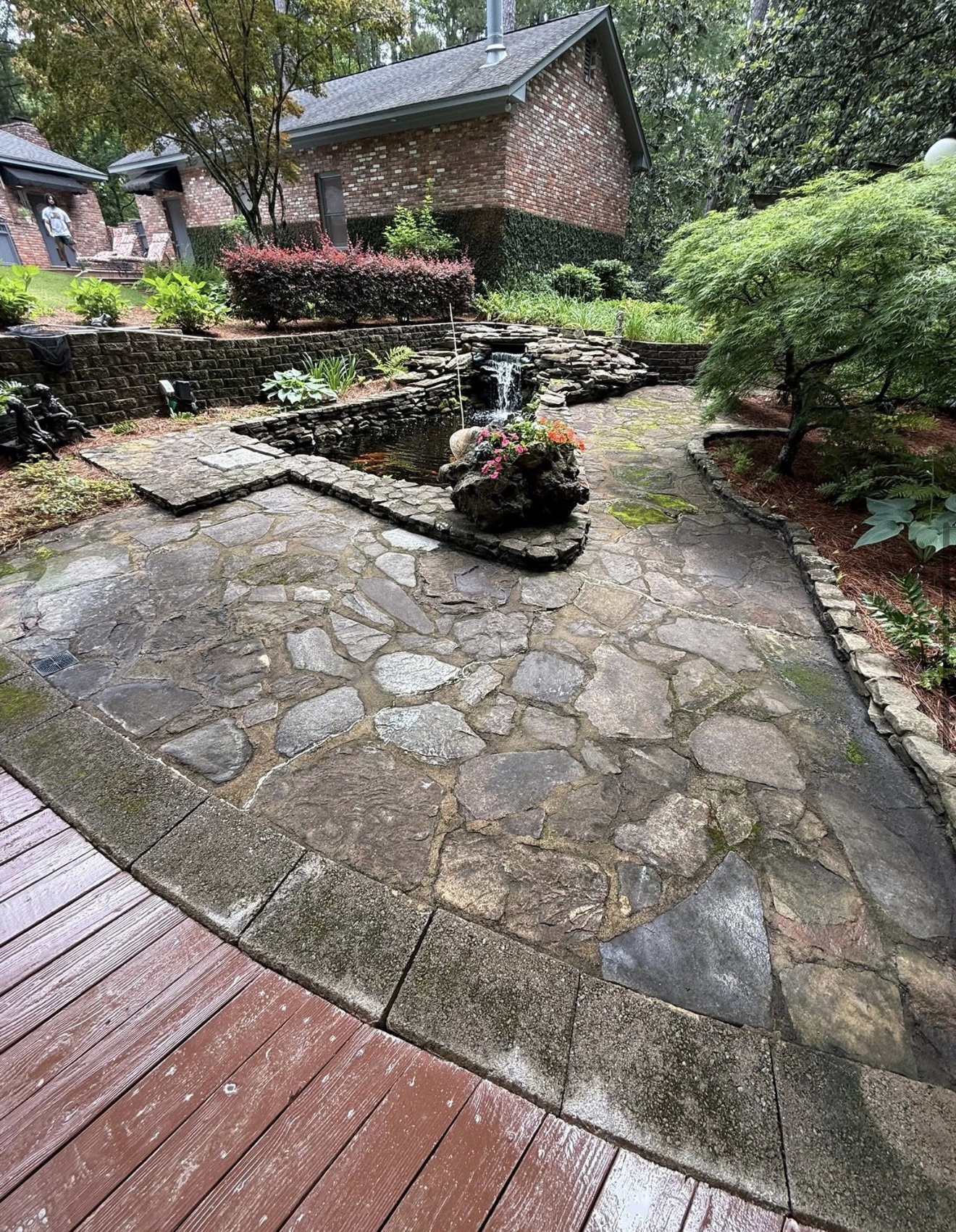 Dirty mossy flagstone patio before pressure washing in Columbus, GA