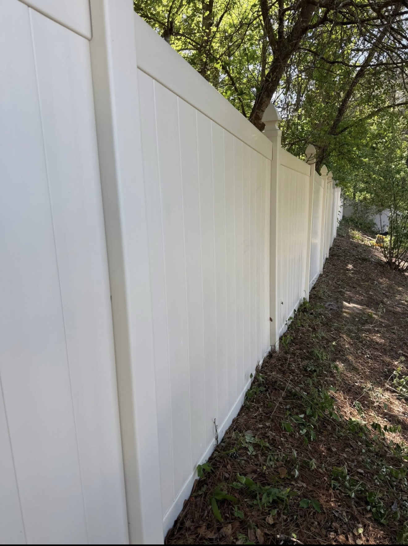 Bright white privacy fence after a soft wash in Columbus, GA
